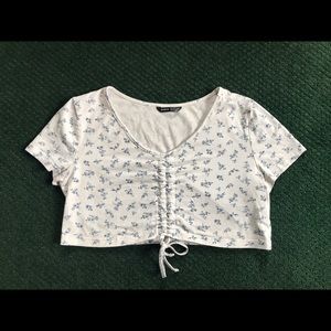 Short sleeve very cropped shirt from SHIEN. White with blue flowers